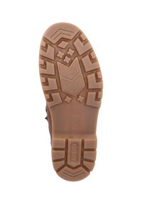 Suela de goma marrón con patrones de agarre texturizados, incluyendo flechas y flores, y un logotipo de marca. Tacón redondeado para mayor estabilidad.