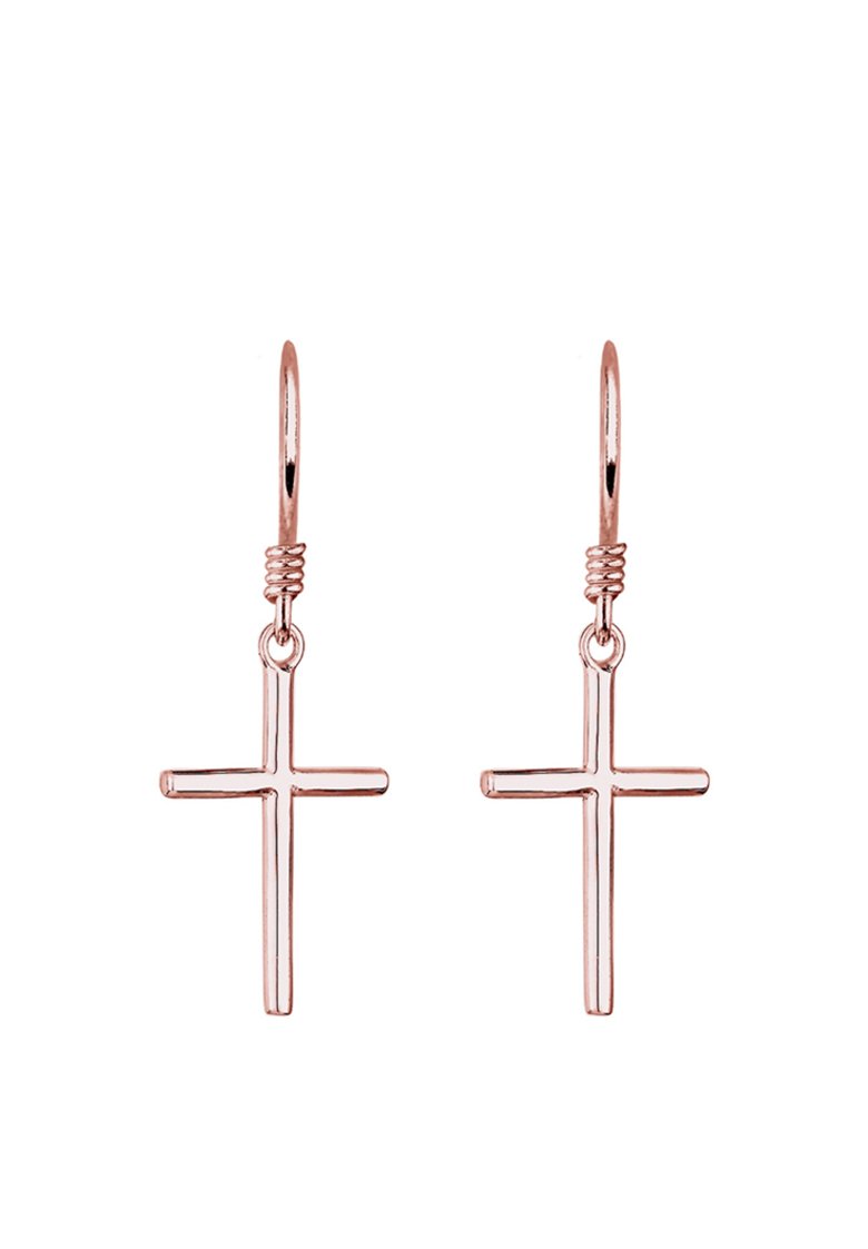 Ohrringe aus Roségold mit Kreuzanhängern. Die Kreuze sind elegant, minimalistisch und hängen an dünnen Draht-Haken mit einem gedrehten Akzent.