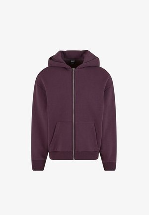 Lila zipzáros kapucnis pulóver, puha anyagból készült, tágas kapucnival, két elülső zsebbel, valamint bordás mandzsettákkal és aljjal.
