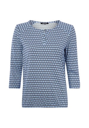 Hellblaues Langarmhemd mit schwarzem Ovalmuster, rundem Ausschnitt und drei Knöpfen in der vorderen Mitte.