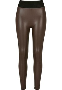 Braune metallische Leggings mit einem schwarzen Bund, hergestellt aus einem glatten, dehnbaren Material, das eng anliegt.