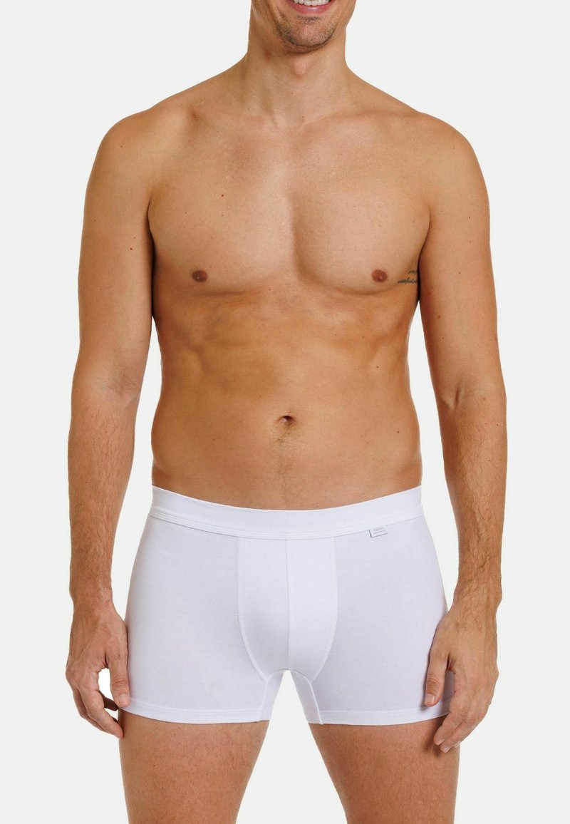 White cotton boxer briefs with a soft elastic waistband. The fabric is smooth and fitted, offering a classic and simple design.