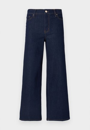 Tamsiai mėlyni platūs džinsai su aukštu juosmeniu, priekinėmis kišenėmis ir matomais siūlių akcentais, su klasikiniu sagutės užsegimu.