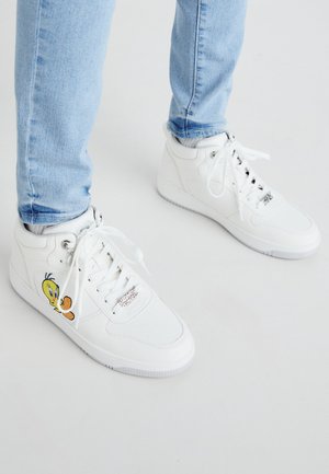 White high-top sneakers with a textured finish, featuring an embroidered Tweety Bird design on the outer side and lace-up closure.