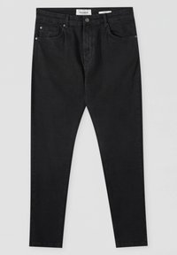 Jean skinny noir taille haute avec poches avant, fermeture par boutons et passants de ceinture, posé à plat sur un fond uni.