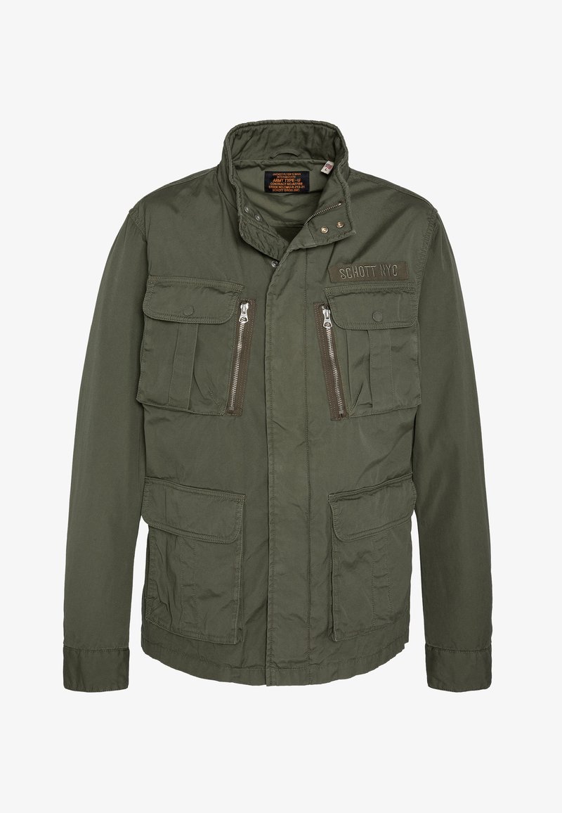 Veste militaire vert olive avec un col monté, fermeture éclair à l'avant, deux poches poitrine et deux poches à rabat inférieures. Fabriquée en tissu léger.