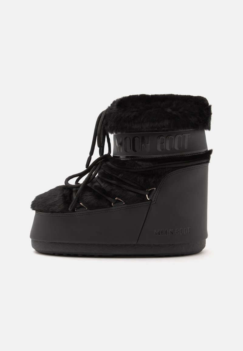 Botte Moon noire avec bordure en fausse fourrure, lacets à l’avant et semelle épaisse conçue pour temps froid et neige.