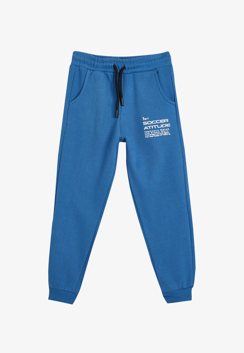 Pantalon de survêtement bleu en tissu doux, avec une taille élastique dotée d'un cordon de serrage, des poches latérales et un texte imprimé en blanc à l'avant.