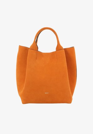 Orangene Wildleder-Shopper-Tasche mit kurzen Griffen, strukturierter Form, kontrastierendem schwarzen Besatz und dezenten Metallakzenten am Boden.