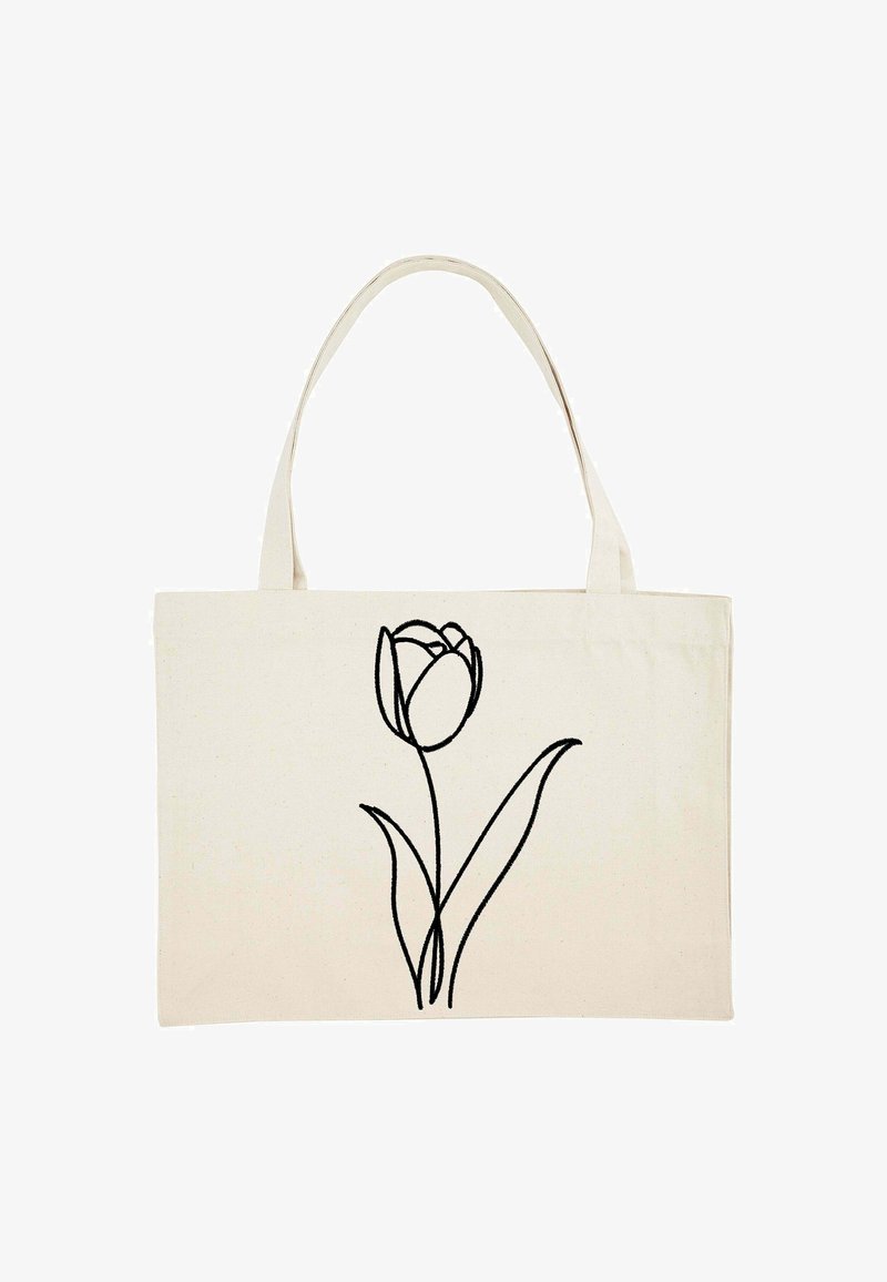Beige szövet bevásárlótáska két fogantyúval, amelyen egy egyszerű fekete vonalrajz látható egy egyszemélyes tulipán virágról, szárával és leveleivel.