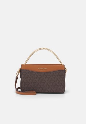 Brown and tan Michael Kors handbag with gold chain top handle and detachable leather shoulder strap on white background.