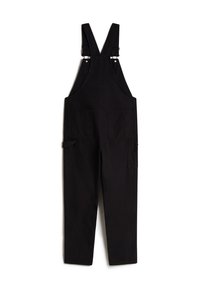 Zwarte katoenen dungarees met verstelbare banden, twee voorzakken en een losse pasvorm. Gemaakt van stevige stof en met een minimalistisch design.