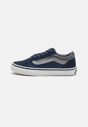 Navy blue low-top sneaker with gray side stripe, white rubber sole, lace-up closure, and padded collar, shown in profile on a white background.