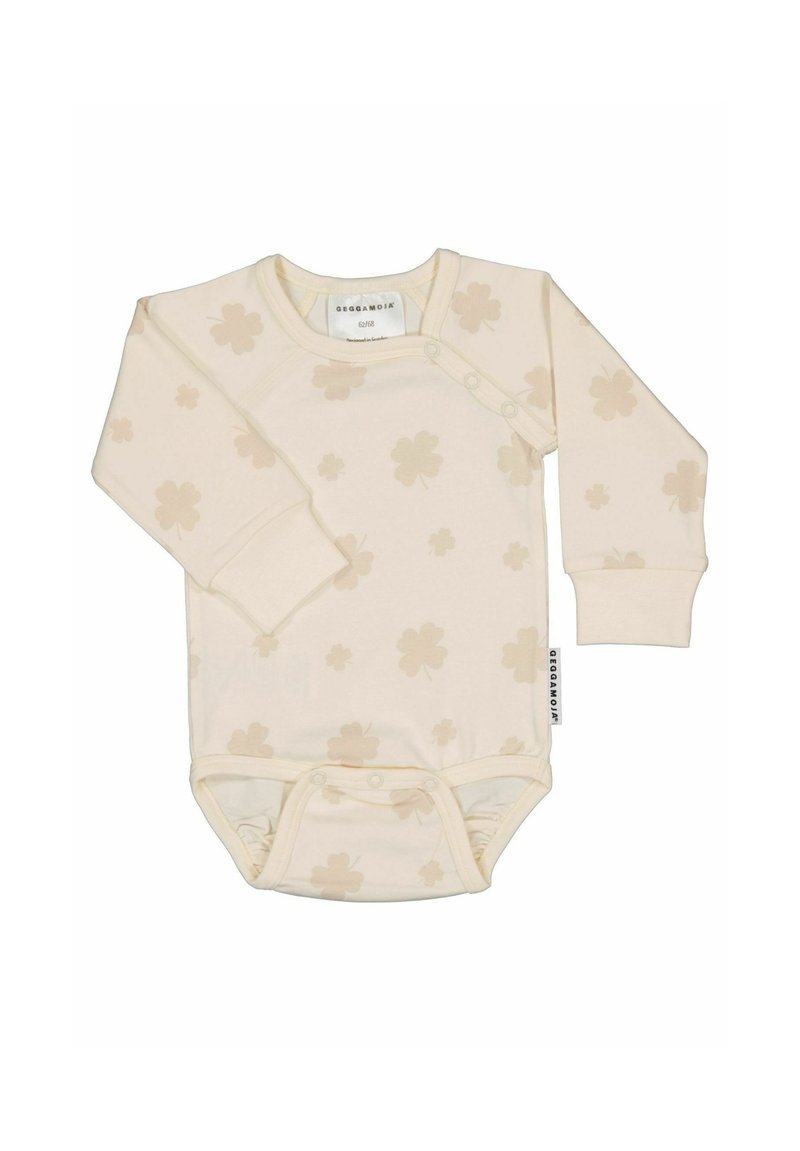 Långärmad bodysuit i grädde med ljusbeige blommönster, tryckknappar vid axeln och en mjuk, stretchy finish.