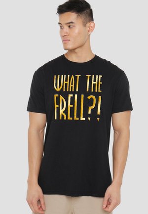 Black cotton t-shirt featuring bold, metallic gold text reading "WHAT THE FRELL?!" in a playful font. Short sleeves, crew neck design.