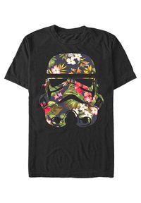 Svart bomull T-shirt med ett design av en stormtrooperhjälm fylld med färgglada tropiska blommor och gröna blad.