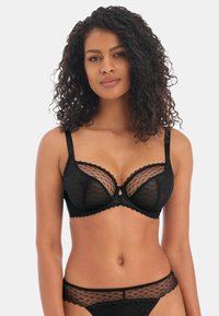 Black lace bra featuring sheer polka dot panels, scalloped trim, underwire support, and a small keyhole detail at the center.