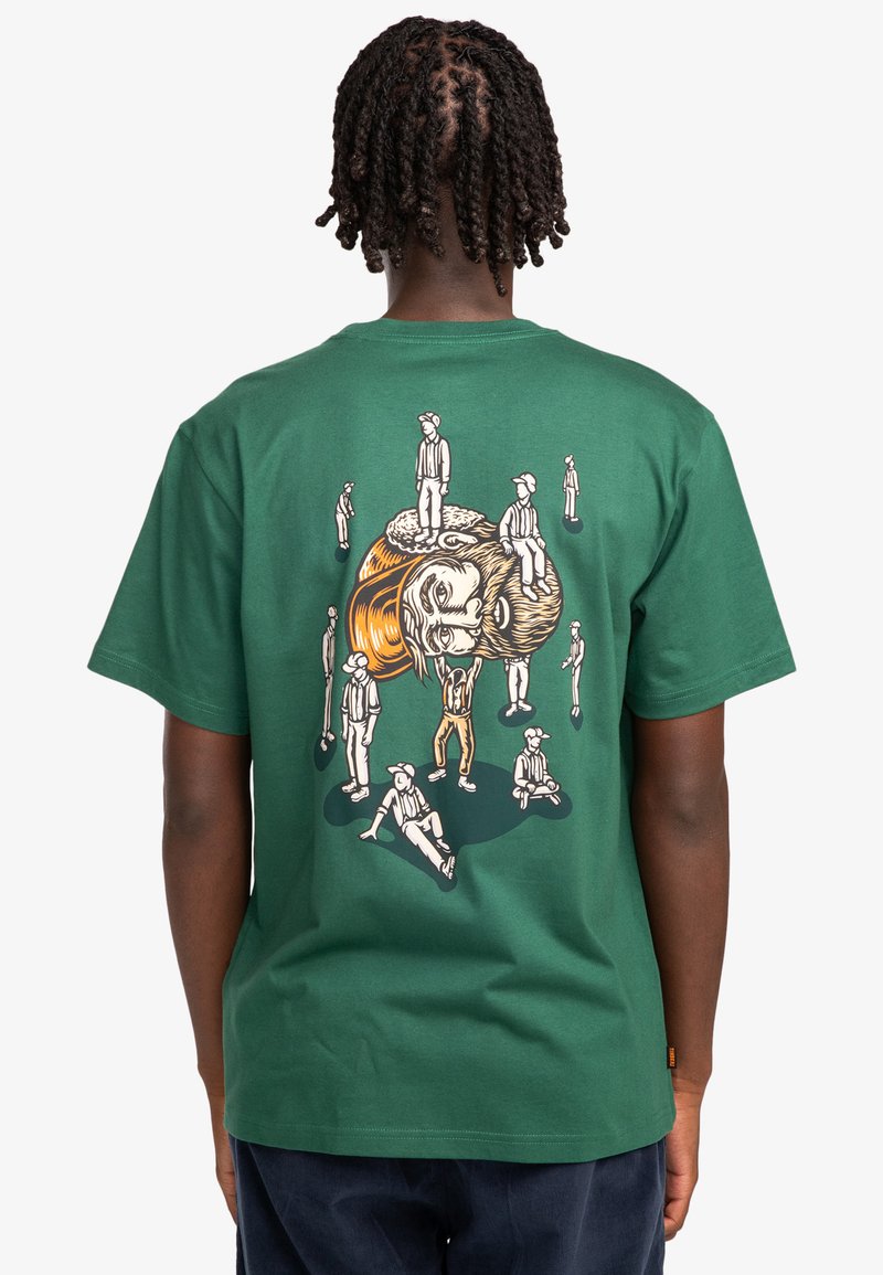 Green cotton t-shirt featuring a detailed graphic print on the back, depicting multiple figures with varying poses and facial expressions.