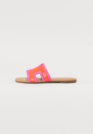 Open-toe slide sandal with a flat sole. Bright orange and pink colors, featuring a geometric design in the upper band with a smooth texture.