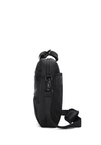 Black crossbody bag made of durable fabric; features a smooth texture, a top zipper, adjustable strap, and a clip for secure closure.