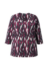 Kortärmad topp med V-ringning, tillverkad av mjukt tyg med ett vågigt mönster i nyanser av burgundy, svart och vitt.