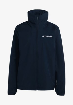 Námornícky modrý nepremokavý kabát s vysokým golierom, plným predným zipsom a bielym logom TERREX. Hladká textúra, navrhnutý na vonkajšie nosenie.