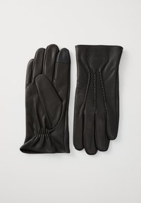 Mănuși din piele neagră cu o textură netedă, �încheietură elastică și detalii cusute. Oferă un vârf de deget compatibil cu ecranul tactil pe una dintre mănuși.