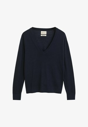 Pull en V bleu marine en tissu doux, doté de manches longues, de poignets côtelés et d'un ourlet côtelé. Étiquette cousue à l'intérieur du col.