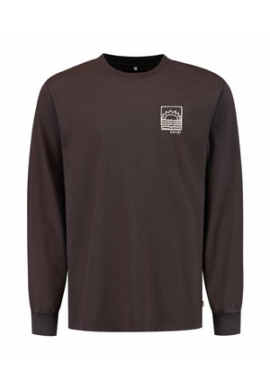 Long-sleeve shirt in dark brown cotton, featuring a white printed sun and wave design on the left chest pocket area. Round neckline, straight fit.