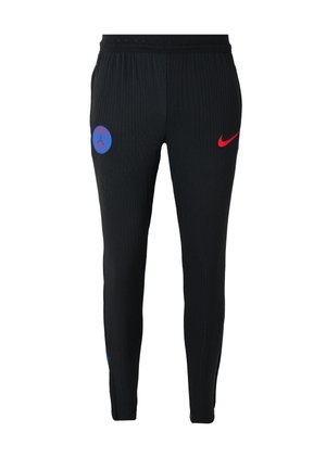 Sorte ribbede træningsbukser med et blåt emblem og et rødt Nike-logo, designet med en tætsiddende pasform og strækbart stof for komfort.