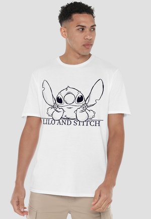 Weißes Baumwoll-T-Shirt mit einer schwarzen Kontur von Stitch aus "Lilo und Stitch", darunter der Text "LILO UND STITCH".