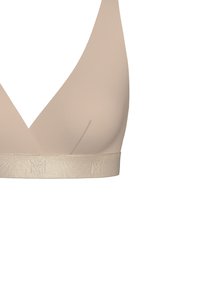 Beige bralette with a smooth, elastic fabric, V-neck design, and a wide band featuring embossed logo detail.