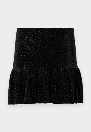 Schwarzer Samtrock mit einem gerafften Saum, verziert mit silbernen Punkten. Verfügt über eine taillierte Taille und eine weiche Textur.
