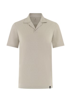 Polo beige a maniche corte con colletto aperto e piccola etichetta nera con logo all'orlo, mostrata su uno sfondo bianco semplice.