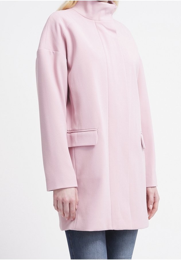 Light pink jacket with a high collar, long sleeves, and side pockets. Made of textured fabric with a straight-cut design.