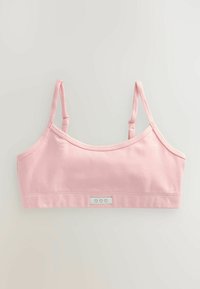 Bralette rosa in cotone con sottili spalline regolabili e una texture liscia. Presenta un'etichetta con tre icone a forma di cuore sul davanti.