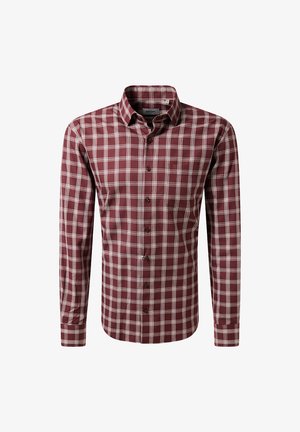 Camicia a maniche lunghe a quadri in bordeaux e crema, presenta un colletto a camicia, bottoni frontali e una sottile tasca sul petto. Tessuto in cotone.