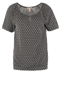 Svart och vit mönstrad kortärmad topp med rundad halsringning och en rynkad fåll. Tillverkad av mjukt tyg med en flödande design.