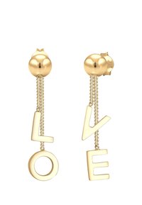 Pendientes de oro con letras colgantes que deletrean "AMOR", con una parte superior redondeada y acentos de cadena que conectan las letras.