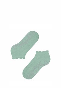 Para jasnobeżowych skarpetek z falistym brzegiem, teksturowaną tkaniną i delikatnym różowym kwiatowym wzorem nadrukowanym po bokach.