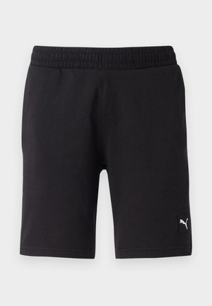 Pantalones cortos deportivos negros con una cinturilla elástica, hechos de material suave, que presentan un pequeño logo blanco de Puma en la parte inferior derecha.