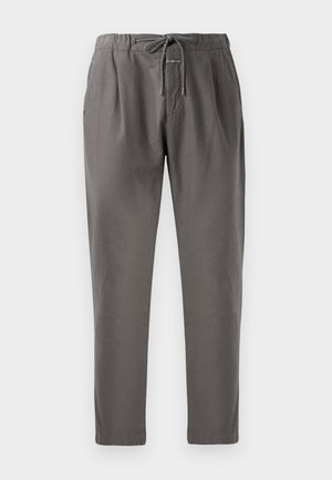 Gray cotton pants with an elastic waistband and drawstring. Features side pockets and a relaxed fit, tapering at the ankles.