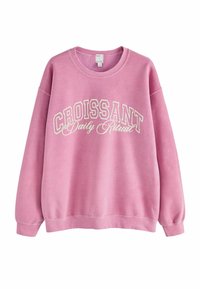 Pink sweatshirt with a crew neck, long sleeves, and white "CROISSANT Daily Ritual" text. Features a soft texture and casual fit.