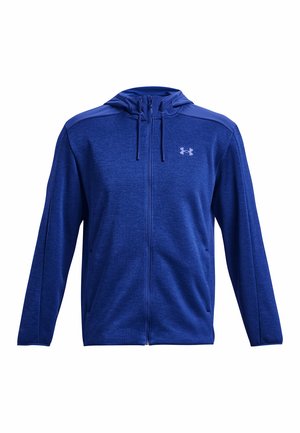 Felpa blu con zip realizzata in tessuto morbido, dotata di cappuccio regolabile, maniche lunghe e logo sul lato sinistro del petto. Texture liscia, design atletico.