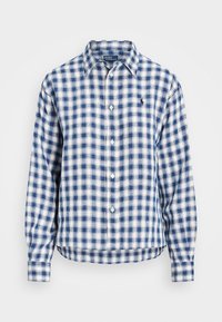 Modrá a bílá kostkovaná košile s dlouhými rukávy, kulatým lemem, zapínáním na knoflíky vpředu a malým logem na hrudi. Tkanina se zdá být lehká.