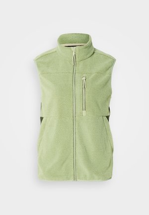 Green fleece vest with high collar, front zipper, and zippered chest pocket. Soft texture, sleeveless design, and side panels in darker green.