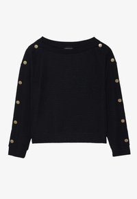 Svart långärmad topp med en bred halsringning, texturerat material och gyllene knappar längs axelsömmarna. Kort modell.