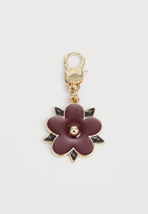 Gold-tone keychain with a maroon flower-shaped charm featuring black petal accents and a clasp engraved with "FURLA."