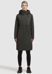 Olive green raincoat with a hood, featuring a cropped design, zippered front, and two side pockets. Smooth texture and minimalist style.