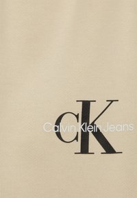 Calvin Klein Jeans MONOGRAM LOGO PANTS UNISEX - Träningsbyxor - muslin